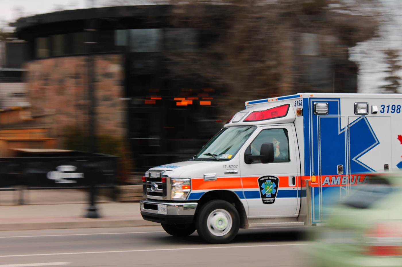 Ambulance driving down a city street