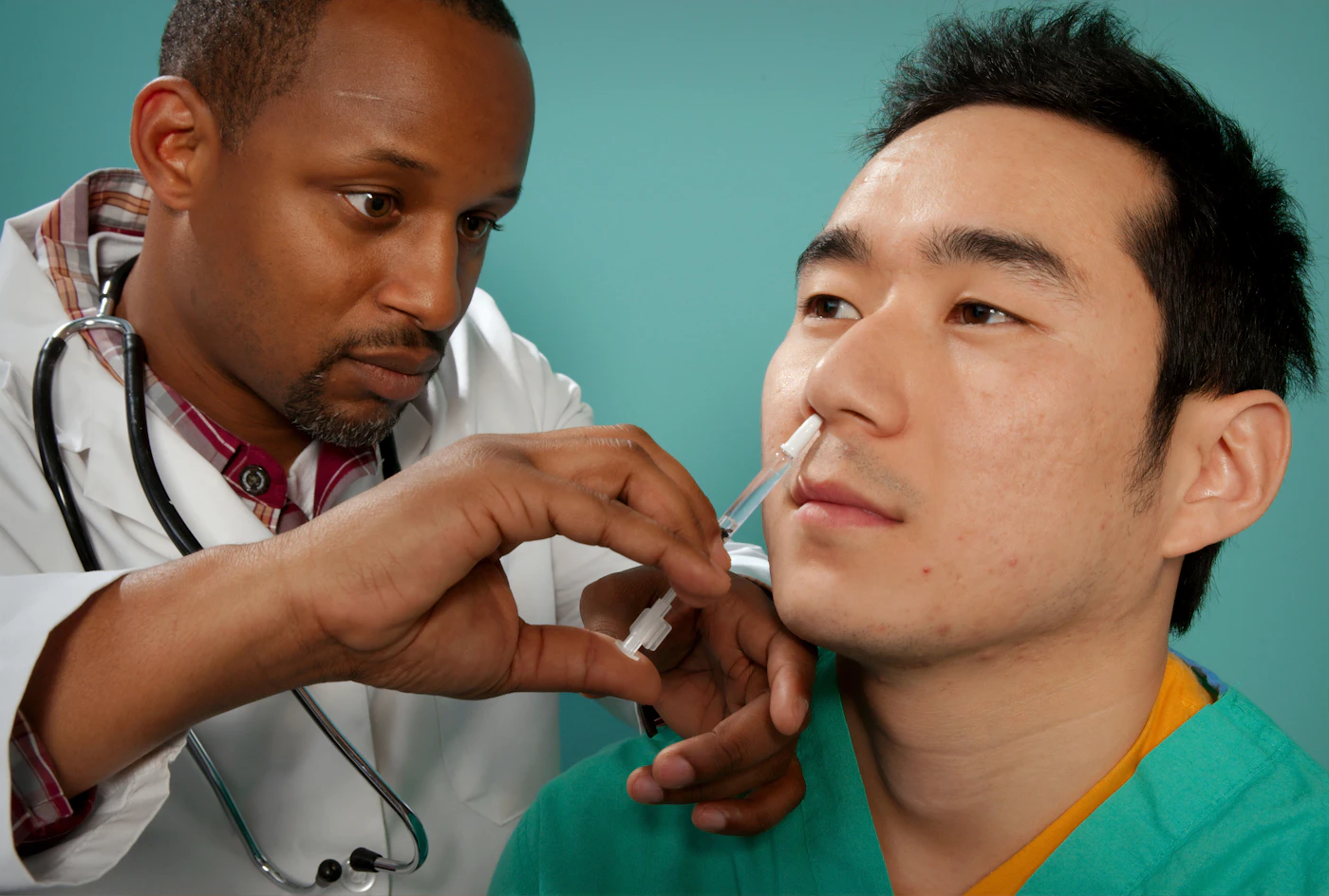 Doctor examining a patient's nose during an ENT visit