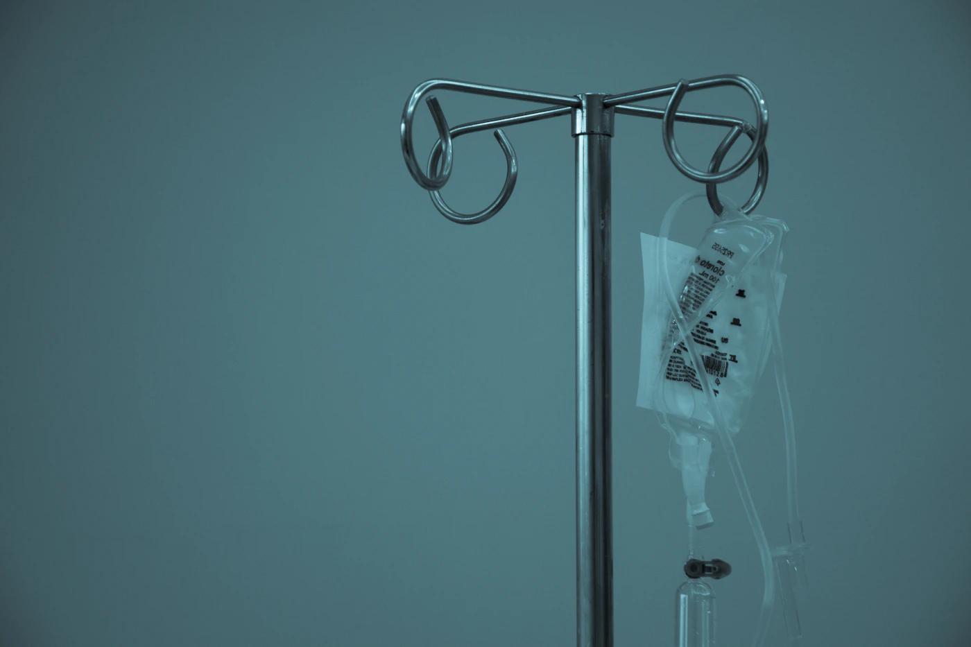 IV bag hanging from a stainless steel infusion stand