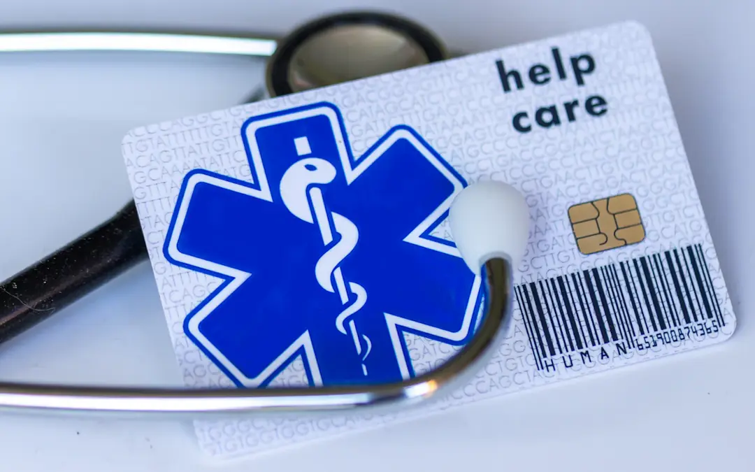 Health insurance card under a stethoscope