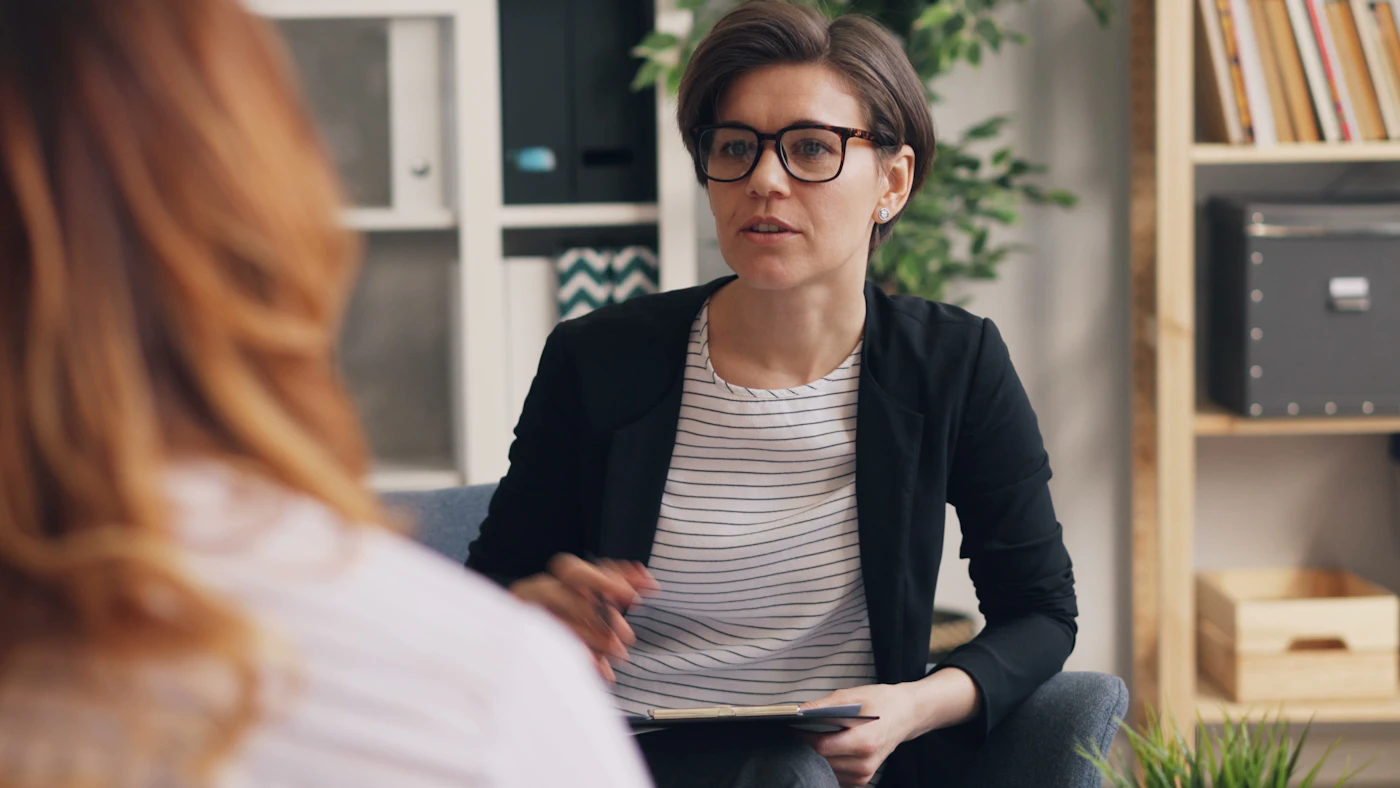 Therapist listening to a client during a counseling session