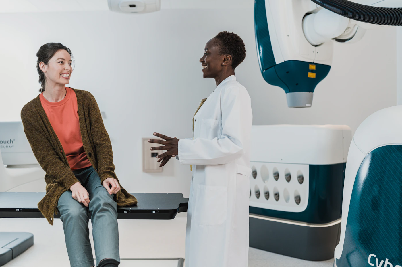 Physician talking with a patient in a clinic exam room