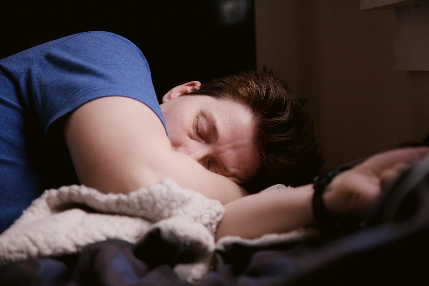 Man asleep in bed at night